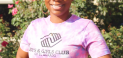 Smiling woman wearing Boys and Girls Club shirt