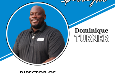 Smiling staff director in blue spotlight graphic