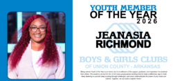 Smiling young woman with long red hair, award poster
